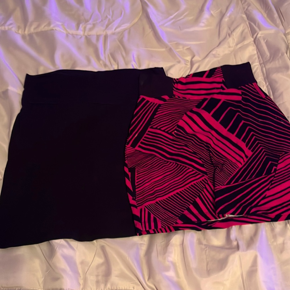 2 mini skirts *pink one is XS *black is L that fits as a M.